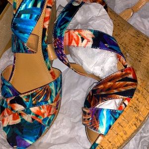 NEW BRAND SHOES , never been worn . Floral heels